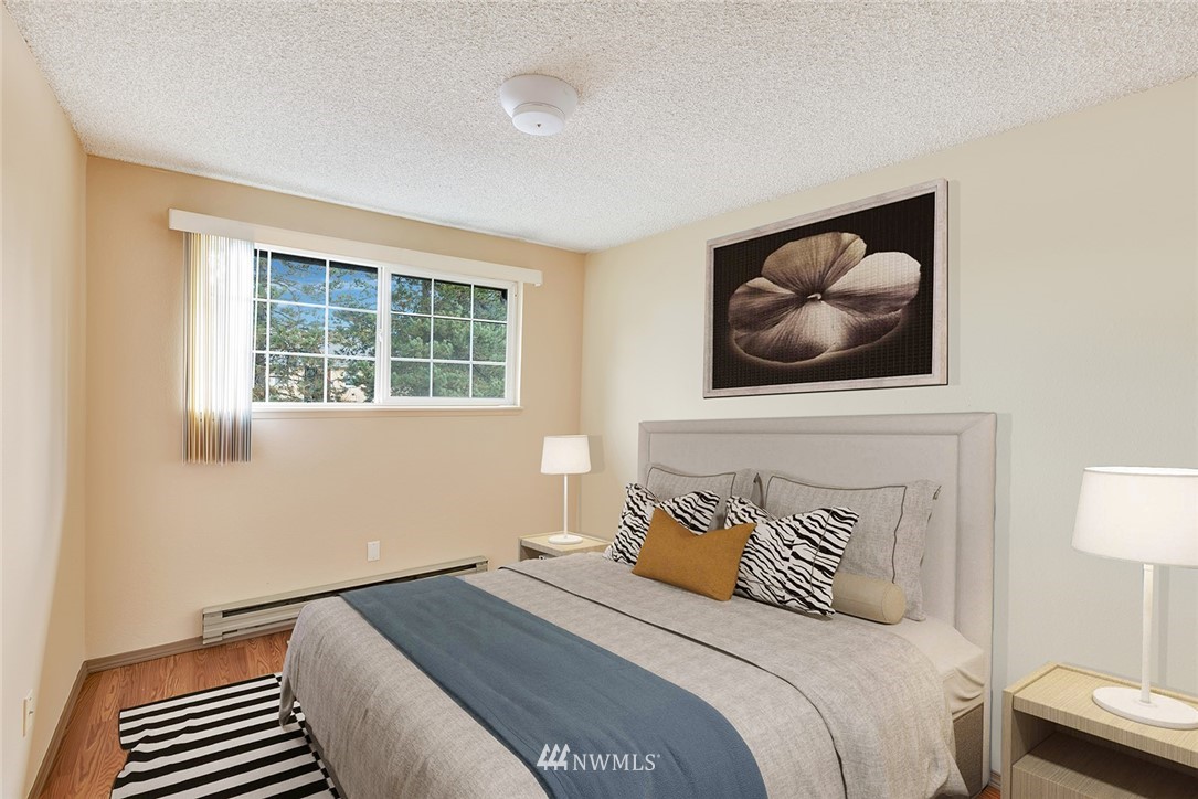 3910 Mason Loop Road Tacoma, WA 98409 - Photo 6 of 9 a bedroom with a bed and a window
