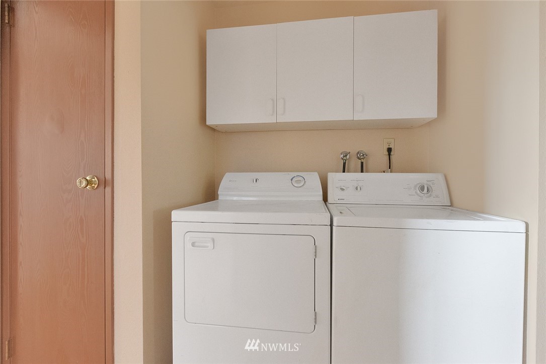3910 Mason Loop Road Tacoma, WA 98409 - Photo 8 of 9 a utility room with dryer and washer