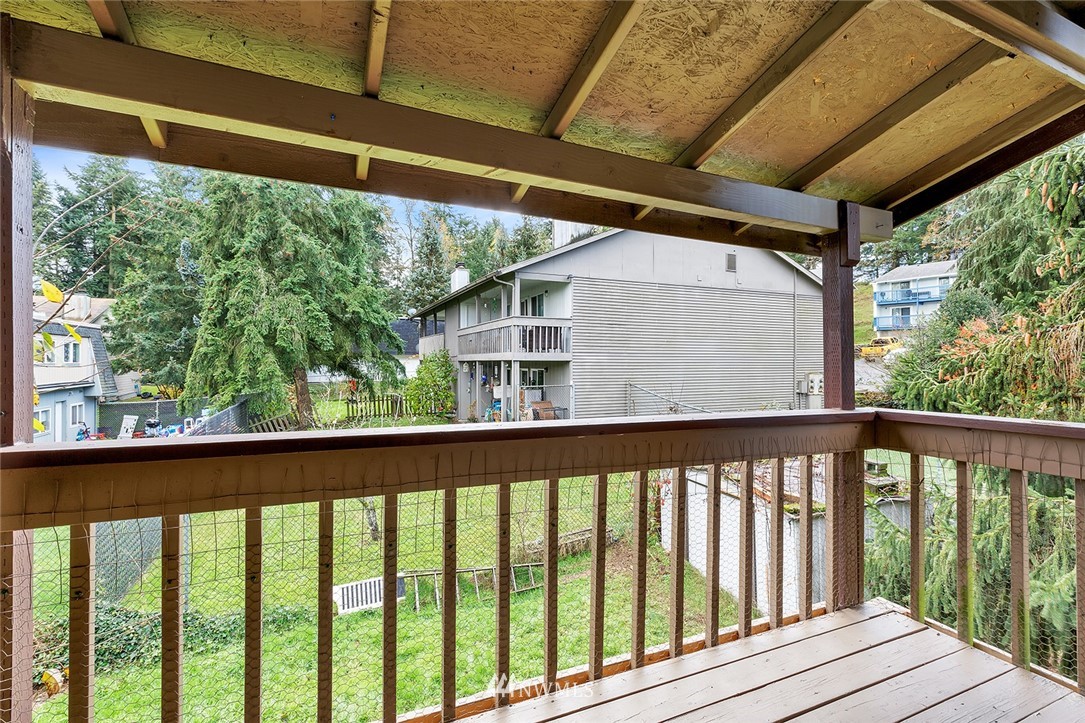 3910 Mason Loop Road Tacoma, WA 98409 - Photo 9 of 9 a view of a balcony with wooden floor