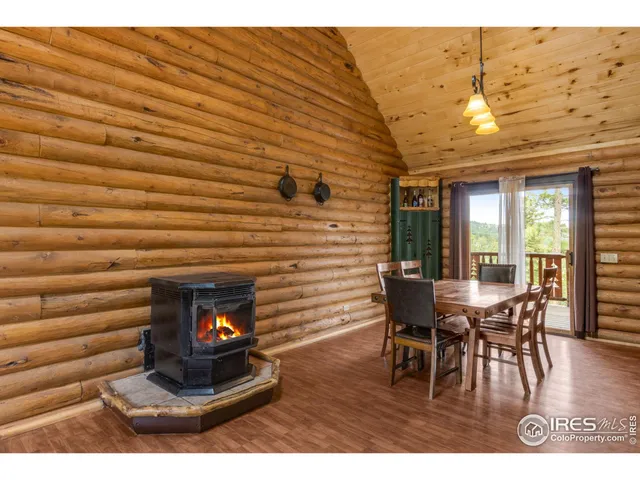 a bedroom with a bed a table and chair