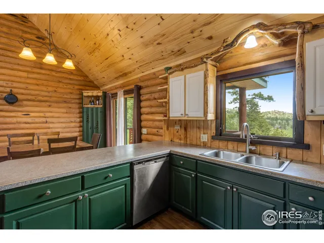 a view of a house with a door and wooden door
