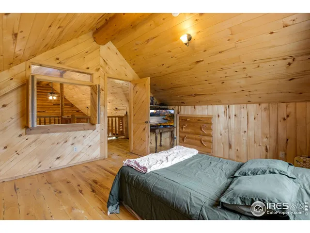 a bedroom with a bed and a view of bedroom