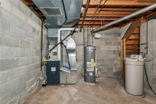 a view of water heater room with a chair