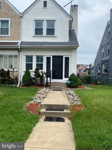 a view of a house with garden and plants