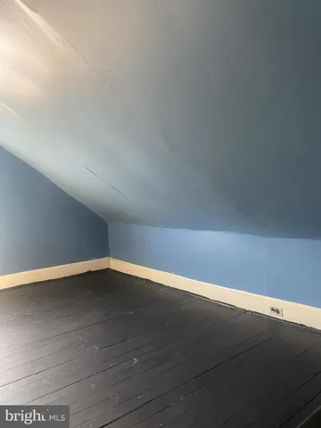 a bathroom with a window and a shower