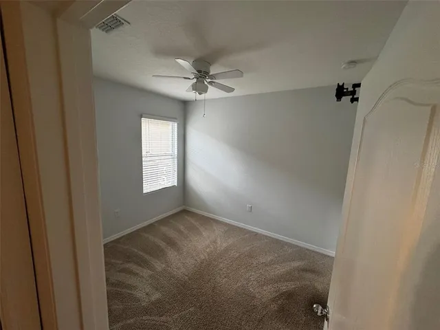 a view of empty room with windows