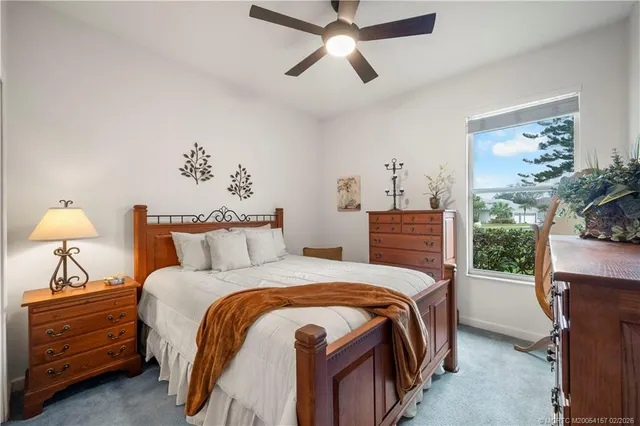 a bedroom with furniture and a flat screen tv