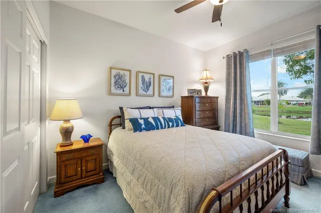 a front view of a house with a chairs and table