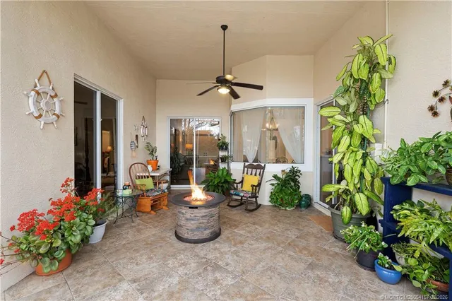 an aerial view of lake and residential houses with outdoor space
