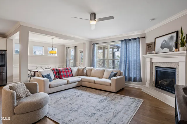 a living room with furniture and kitchen view