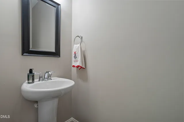 a view of a hallway to a livingroom and a couch