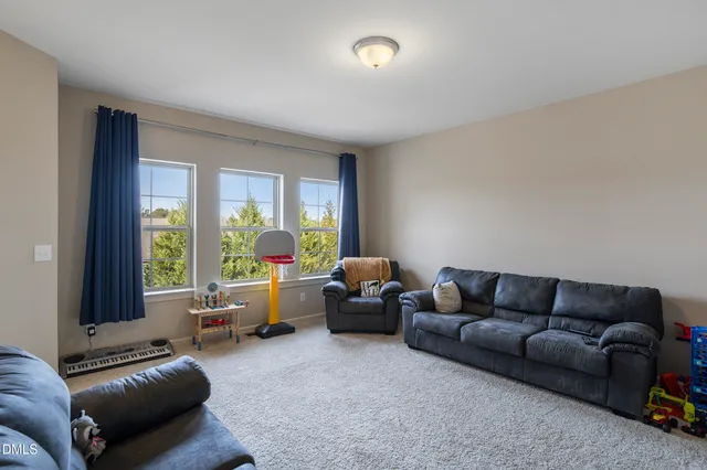 a bedroom with a large bed and a large window