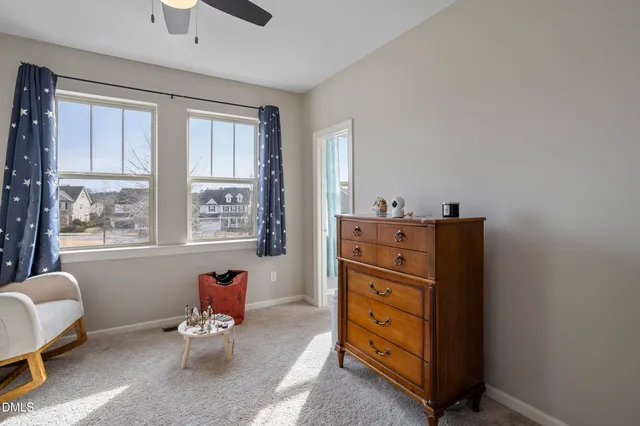 a bedroom with furniture and a rug