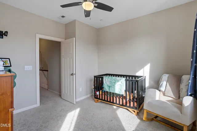 a bathroom with a granite countertop sink and a window