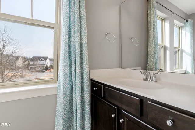 a white toilet sitting next to a shower curtain