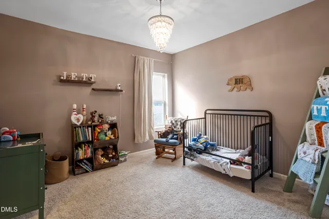 a view of a livingroom with a furniture and a ceiling fan