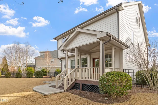 a view of a yard with a tree