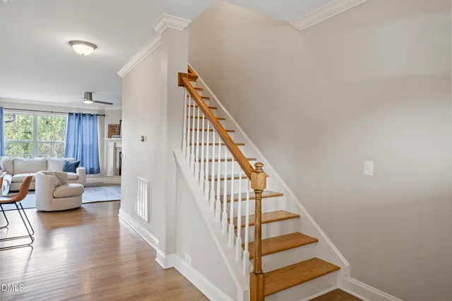 a view of entryway and hall with wooden floor