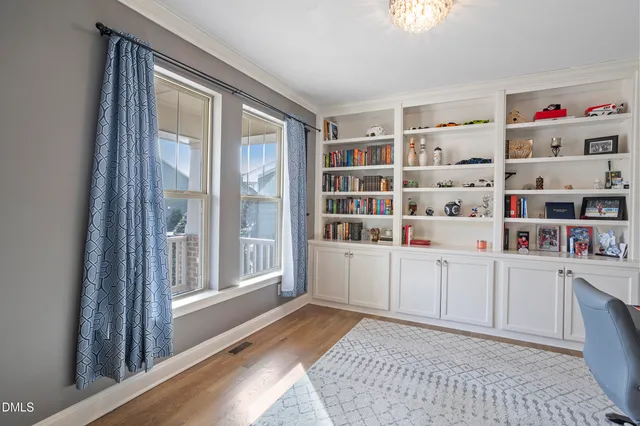 a kitchen with living room appliances furniture and a large window