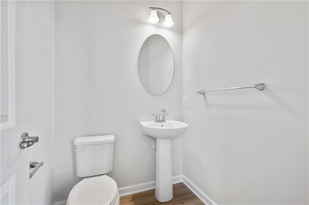 152 Crown Street McKees Rocks, PA 15136 - Photo 7 of 28 a bathroom with a toilet sink and mirror