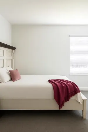 a bedroom with a bed and a night stand