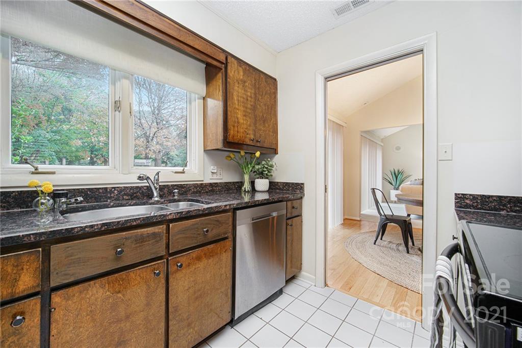 8001 Rising Meadow Road Charlotte, NC 28277 - Photo 18 of 40 a kitchen with a sink and a large window