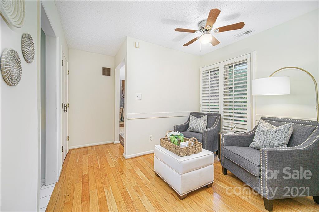 8001 Rising Meadow Road Charlotte, NC 28277 - Photo 20 of 40 a living room with furniture and a wooden floor