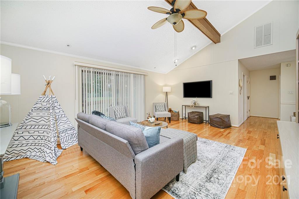 8001 Rising Meadow Road Charlotte, NC 28277 - Photo 23 of 40 a living room with furniture and a flat screen tv