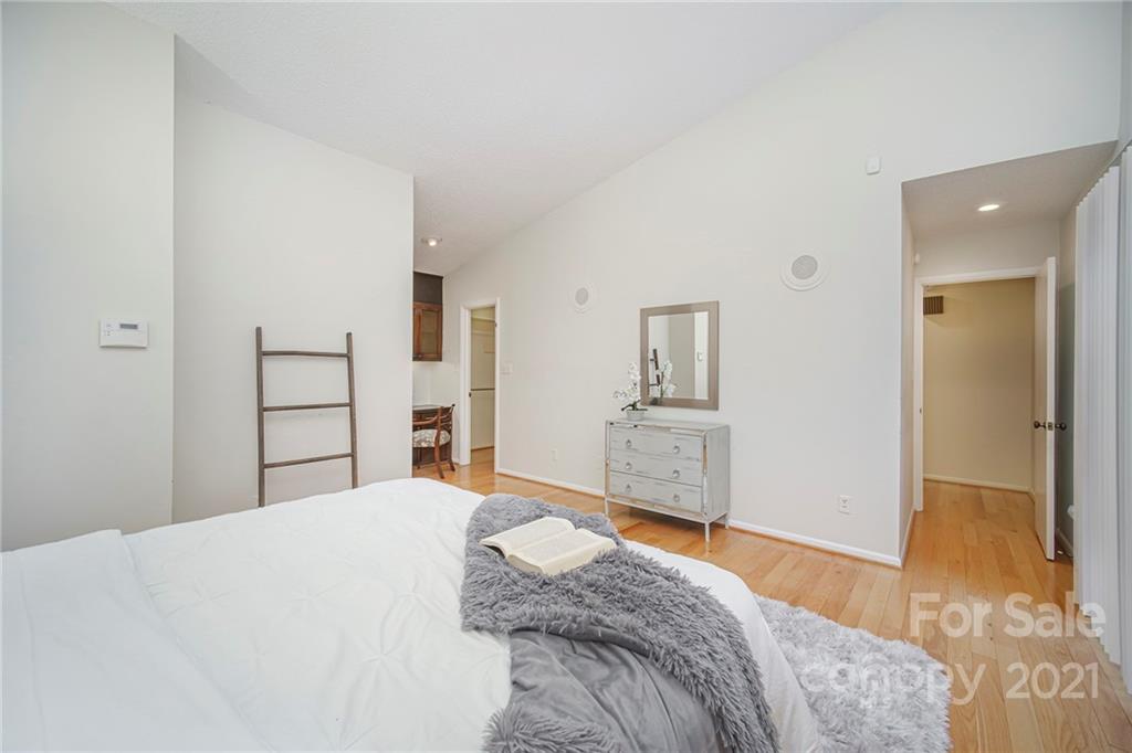 8001 Rising Meadow Road Charlotte, NC 28277 - Photo 29 of 40 a bedroom with a bed and a large mirror