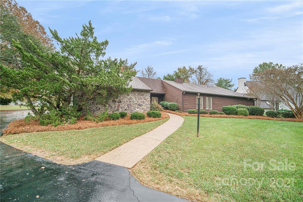 8001 Rising Meadow Road Charlotte, NC 28277 - Photo 4 of 40 front view of a house with a yard