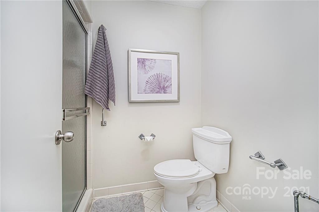 8001 Rising Meadow Road Charlotte, NC 28277 - Photo 33 of 40 a bathroom with a toilet and a shower