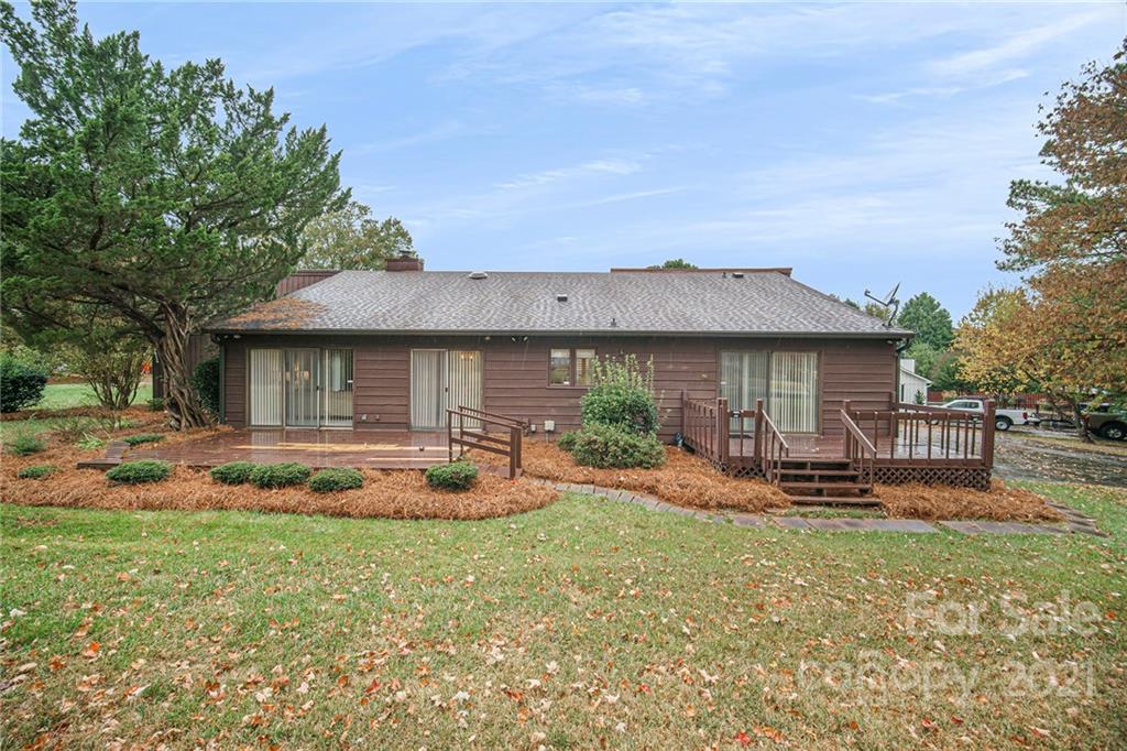 8001 Rising Meadow Road Charlotte, NC 28277 - Photo 35 of 40 a front view of house with yard and seating space