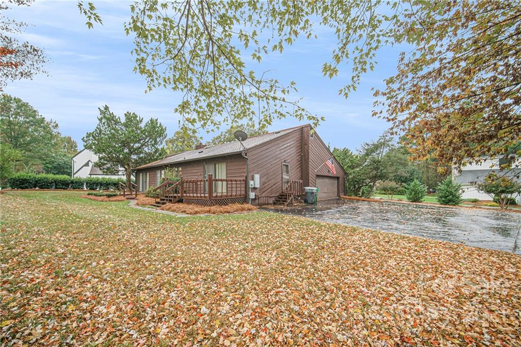 8001 Rising Meadow Road Charlotte, NC 28277 - Photo 38 of 40 a view of a house with a yard