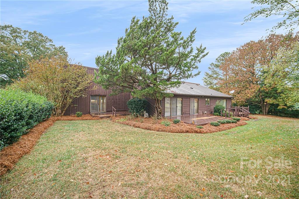 8001 Rising Meadow Road Charlotte, NC 28277 - Photo 39 of 40 a front view of a house with a yard and trees