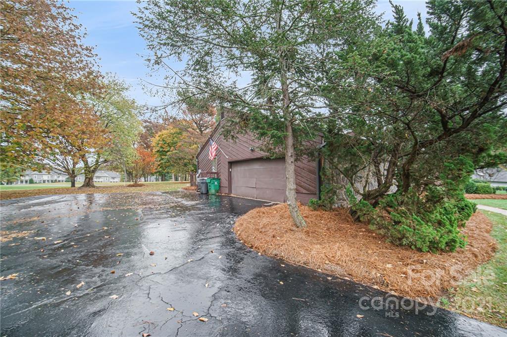 8001 Rising Meadow Road Charlotte, NC 28277 - Photo 5 of 40 a view of a house with a large tree