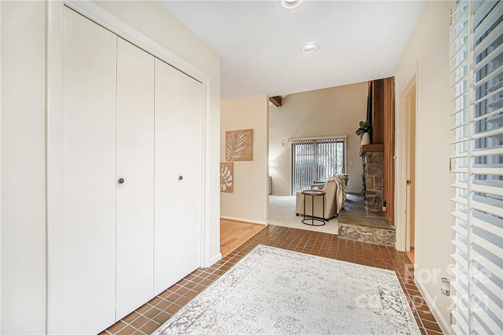 8001 Rising Meadow Road Charlotte, NC 28277 - Photo 6 of 40 a view of a livingroom with wooden floor and a ceiling fan