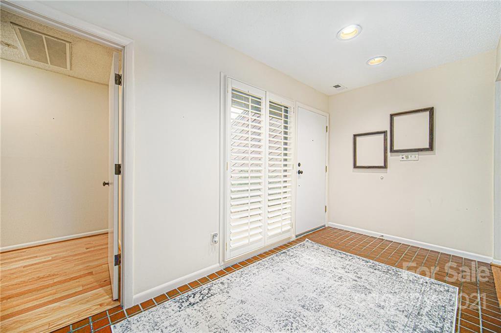8001 Rising Meadow Road Charlotte, NC 28277 - Photo 7 of 40 a view of a room with a window and wooden floor