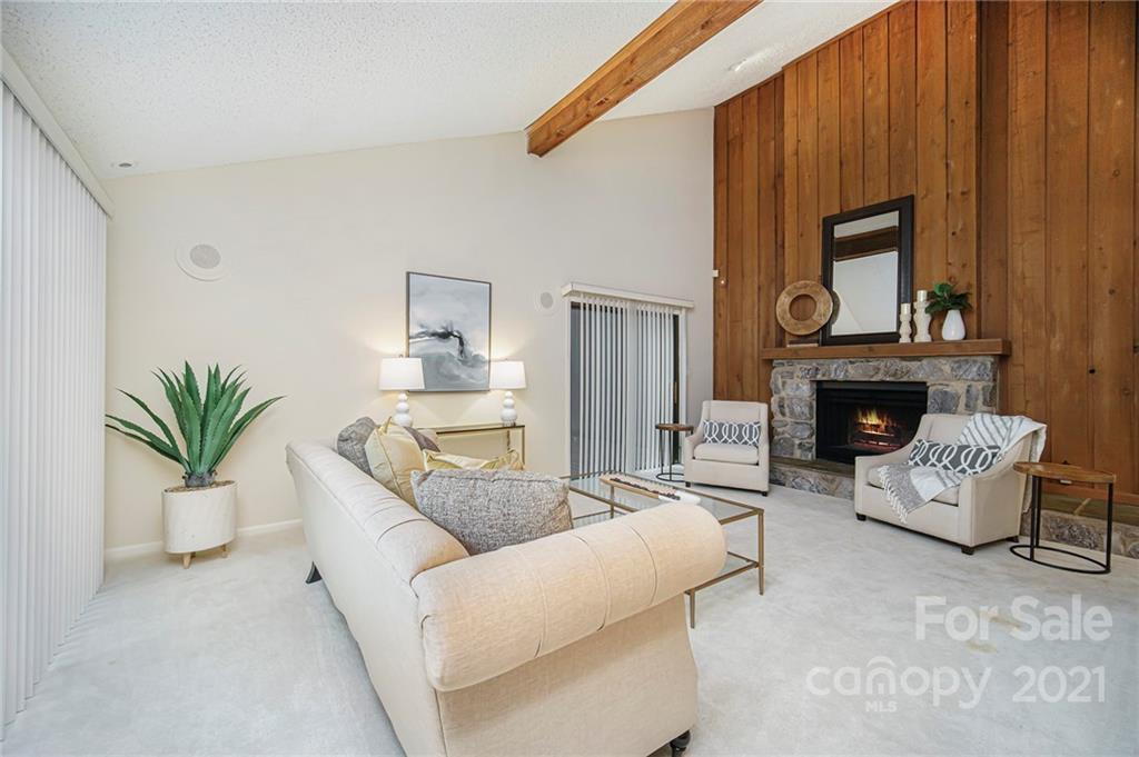 8001 Rising Meadow Road Charlotte, NC 28277 - Photo 10 of 40 a living room with furniture and a fireplace
