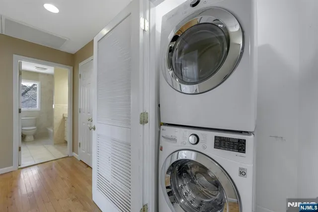 a view of a hallway with washer and dryer
