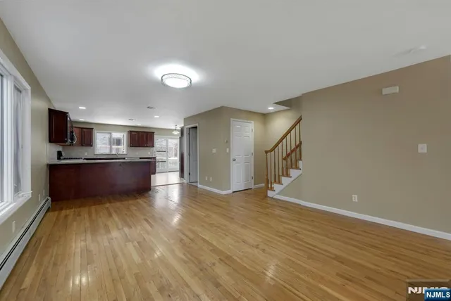 a view of kitchen with wooden floor