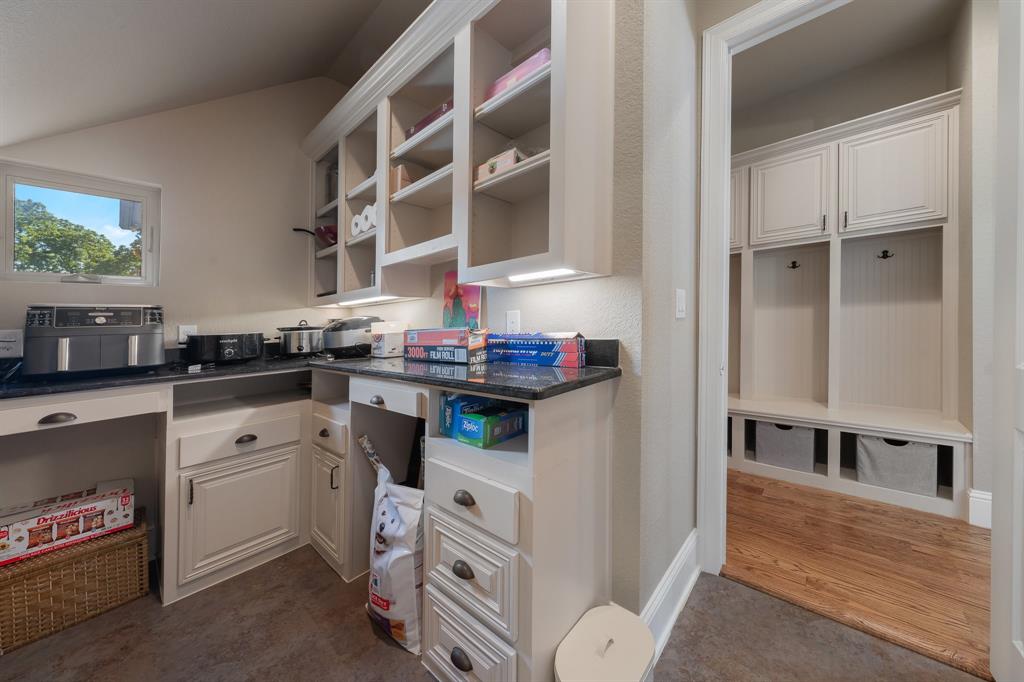 594 Turner Warnell Road Mansfield, TX 76063 - Photo 13 of 38 Kitchen featuring dark granite countertops, and white cabinets
