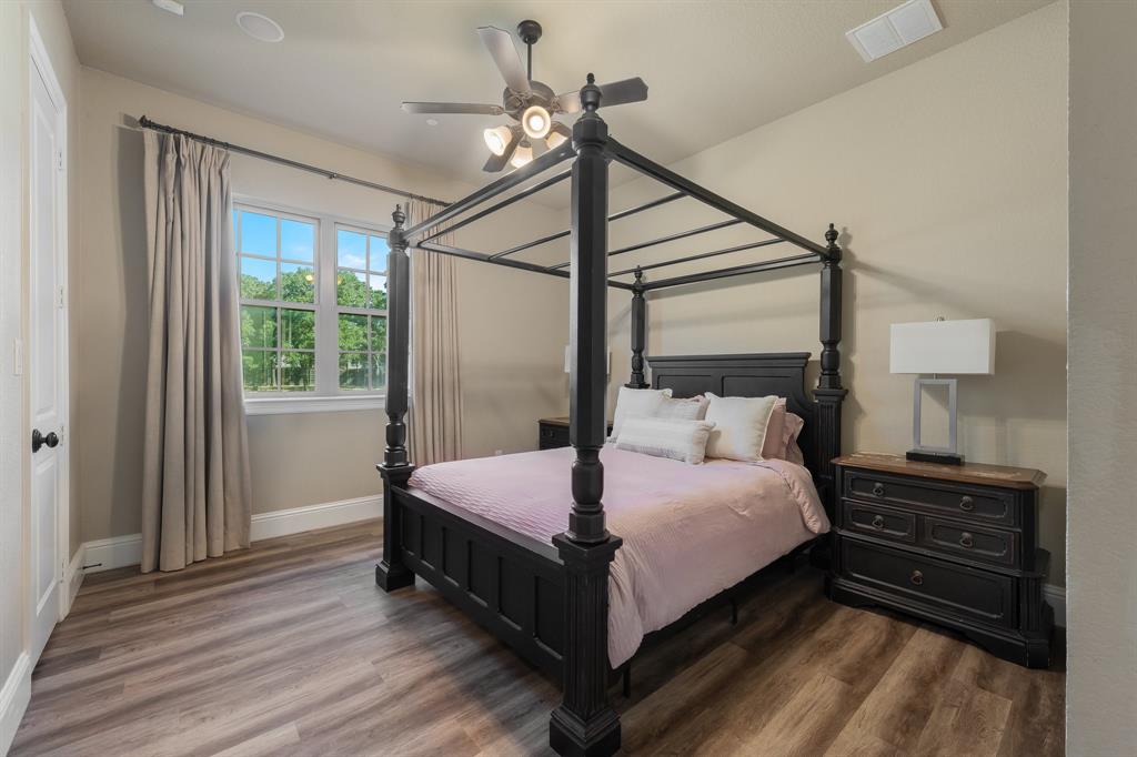 594 Turner Warnell Road Mansfield, TX 76063 - Photo 23 of 38 Bedroom featuring dark wood-style flooring and ceiling fan
