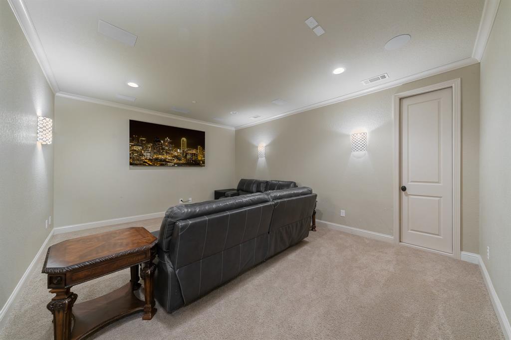 594 Turner Warnell Road Mansfield, TX 76063 - Photo 25 of 38 Home theater room featuring ornamental molding, light carpet, and recessed lighting