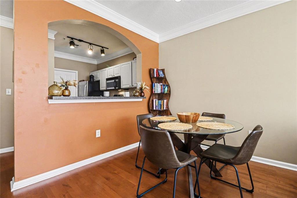 1319 Westchester Ridge Northeast Atlanta, GA 30329 - Photo 12 of 42 a view of a dining room with furniture and wooden floor