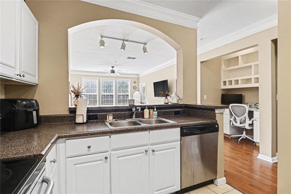 1319 Westchester Ridge Northeast Atlanta, GA 30329 - Photo 15 of 42 a kitchen with granite countertop a sink a stove and cabinets