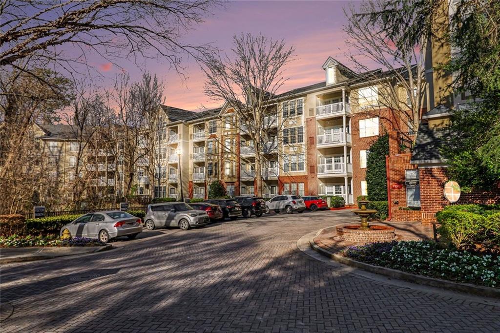 1319 Westchester Ridge Northeast Atlanta, GA 30329 - Photo 2 of 42 a city street lined with buildings and cars
