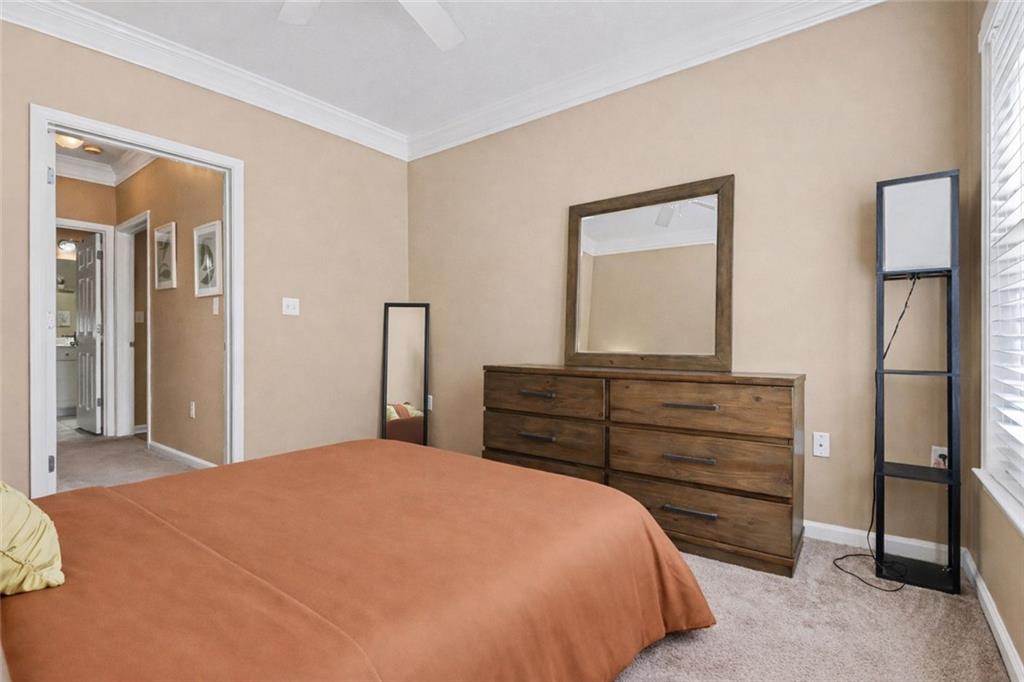 1319 Westchester Ridge Northeast Atlanta, GA 30329 - Photo 22 of 42 a bedroom with a bed and a dresser