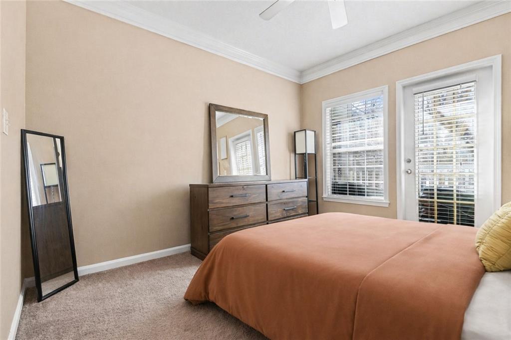 1319 Westchester Ridge Northeast Atlanta, GA 30329 - Photo 23 of 42 a bed sitting in a bedroom next to a window