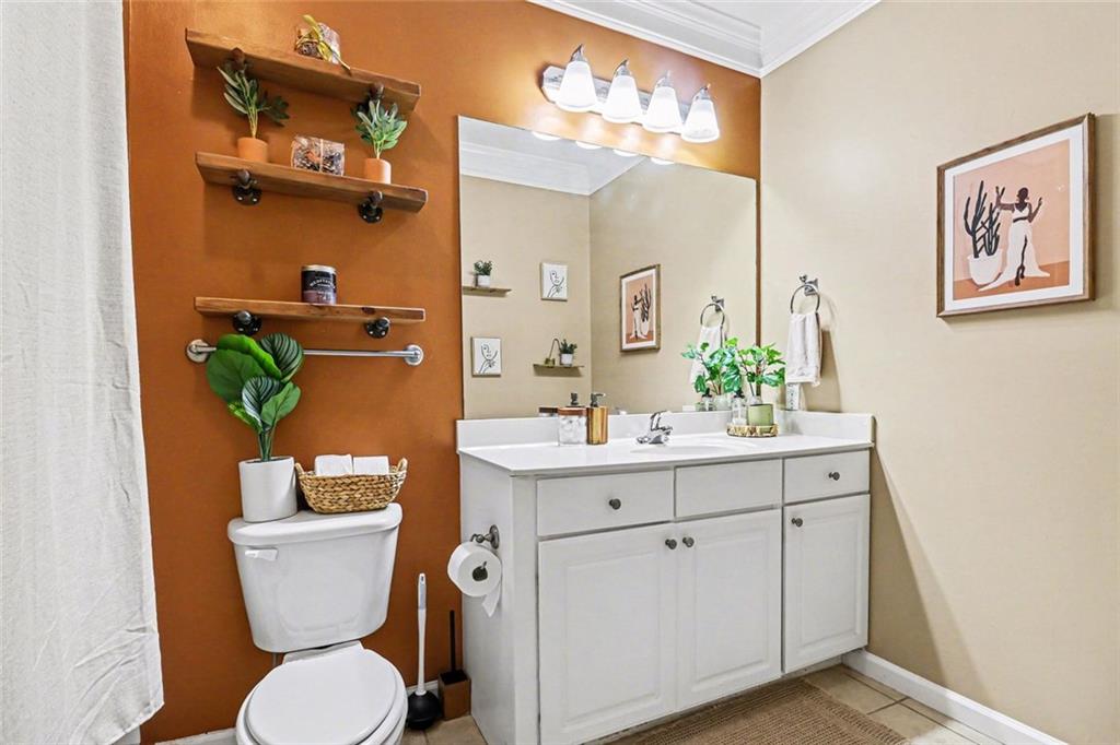 1319 Westchester Ridge Northeast Atlanta, GA 30329 - Photo 24 of 42 a bathroom with a toilet sink and mirror