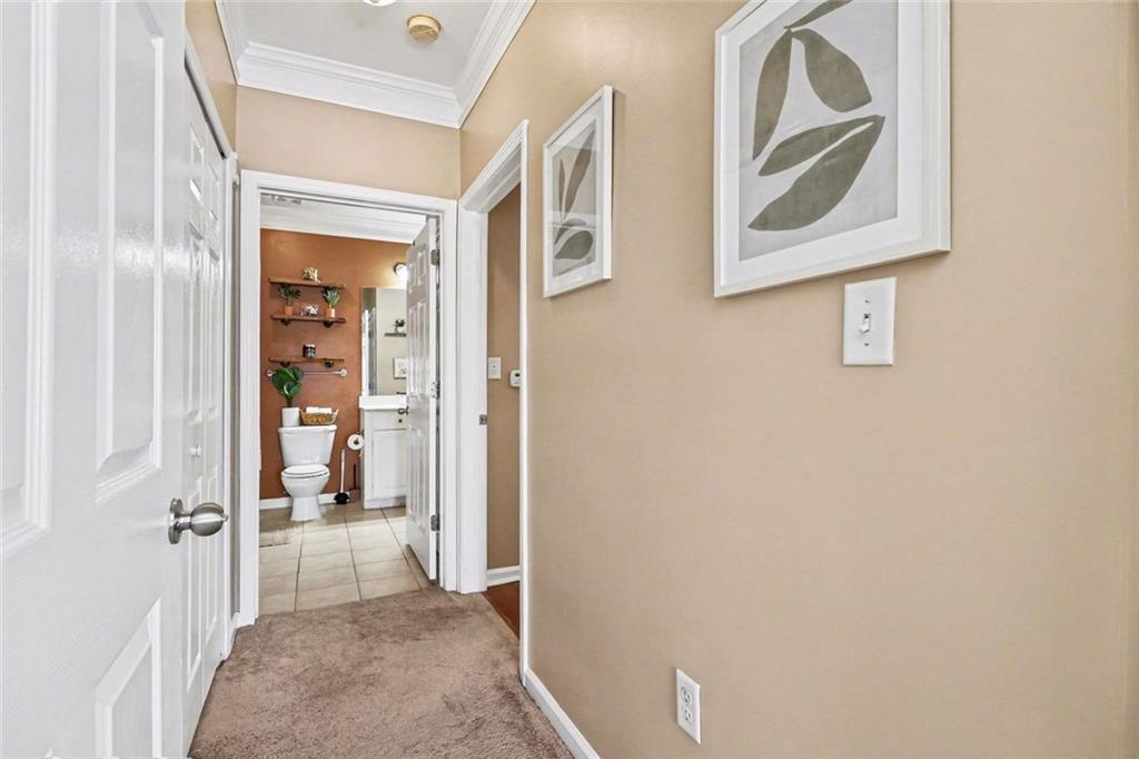 1319 Westchester Ridge Northeast Atlanta, GA 30329 - Photo 25 of 42 a view of a hallway with paintings on the wall